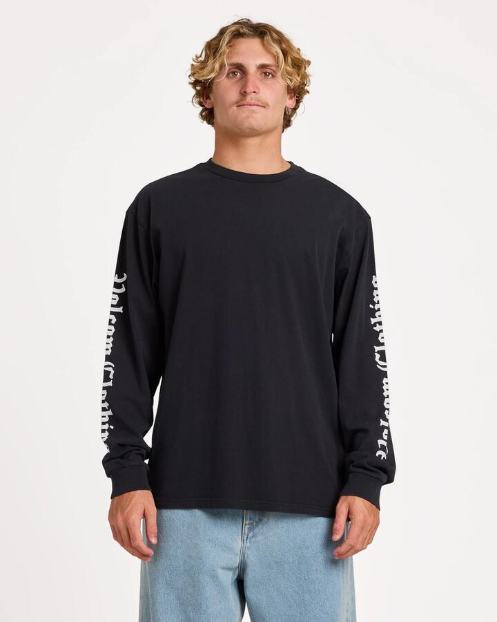 Image of a model wearing Tops. Product name - Volcom Mens Core Gnar Long Sleeve T-Shirt Black in Black colour by brand - Volcom