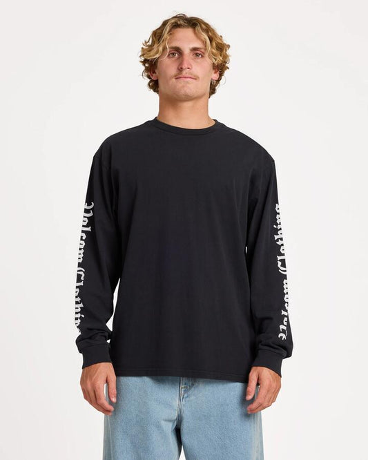 Image of a model wearing Tops. Product name - Volcom Mens Core Gnar Long Sleeve T-Shirt Black in Black colour by brand - Volcom