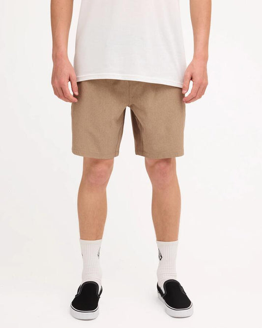 Image of a model wearing Shorts. Product name - Volcom Mens Stones Hybrid Shorts Khaki in Khaki colour by brand - Volcom