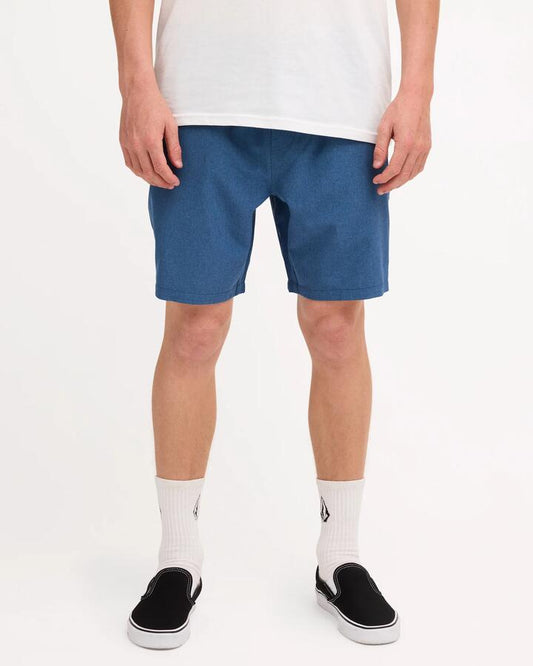 Image of a model wearing Shorts. Product name - Volcom Mens Stones Hybrid Shorts Smoke Blue in Smoke Blue colour by brand - Volcom