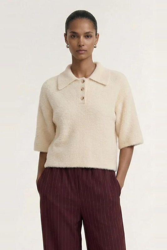 Image of a model wearing Outerwear. Product name - Celine Natural Beige Polo SS Knit Top in Natural colour by brand - Staple The Label