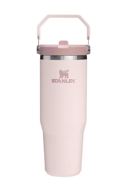 Image of a model wearing Tops. Product name - IceFlow Rose Quartz Flip Straw Top Handle 887ml 2.0 Tumbler in colour by brand - Stanley