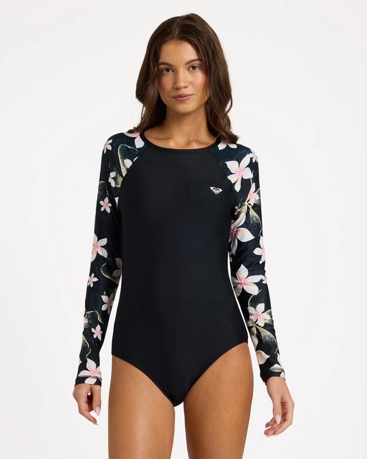 Image of a model wearing Tops. Product name - Roxy Womens Basic Mix Long Sleeve One Piece Swimsuit Anthracite Hibiscus Real S in Anthracite Hibiscus Real S colour by brand - Roxy