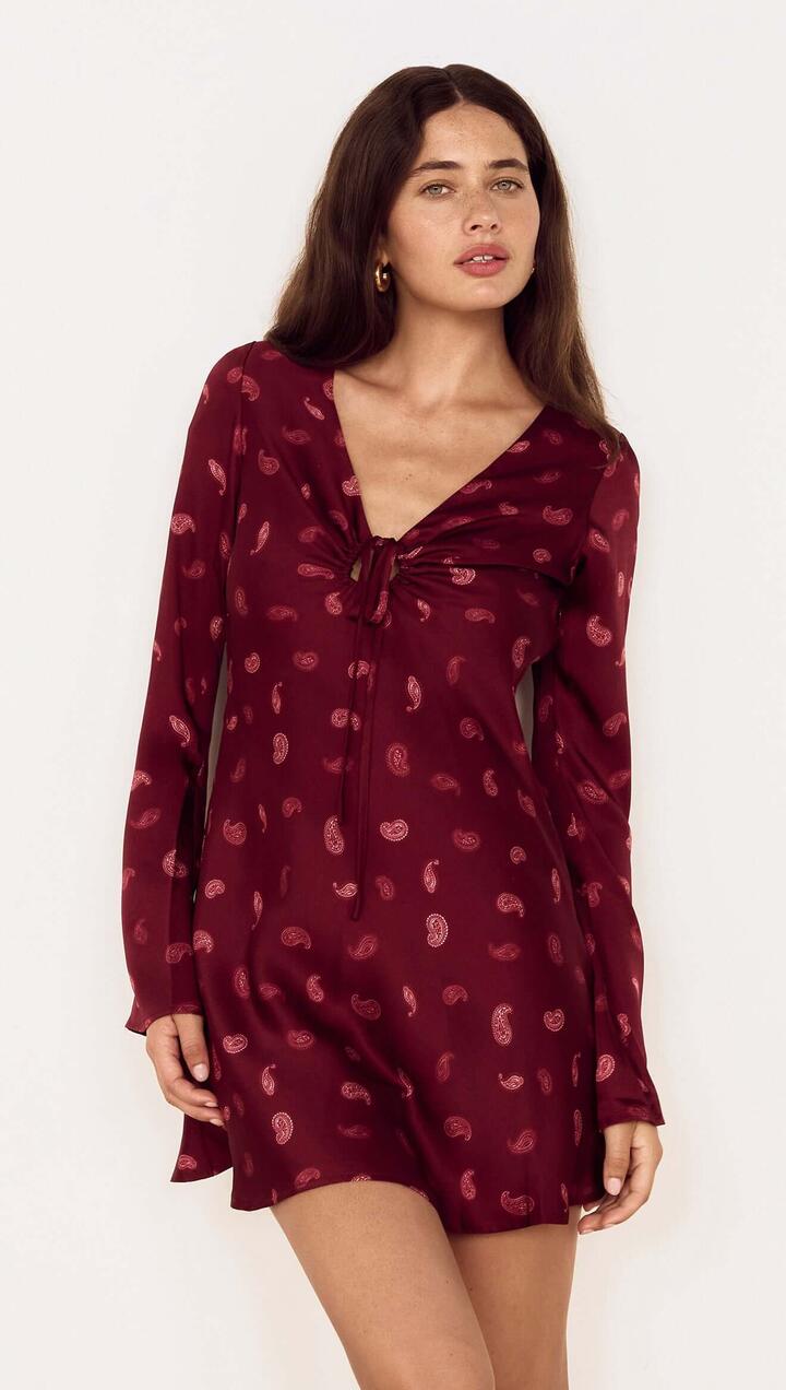 Image of Dresses. Product name - Wine Satin Paisley Knot Front Bias Mini Dress in Wine Paisley colour by brand - MINKPINK