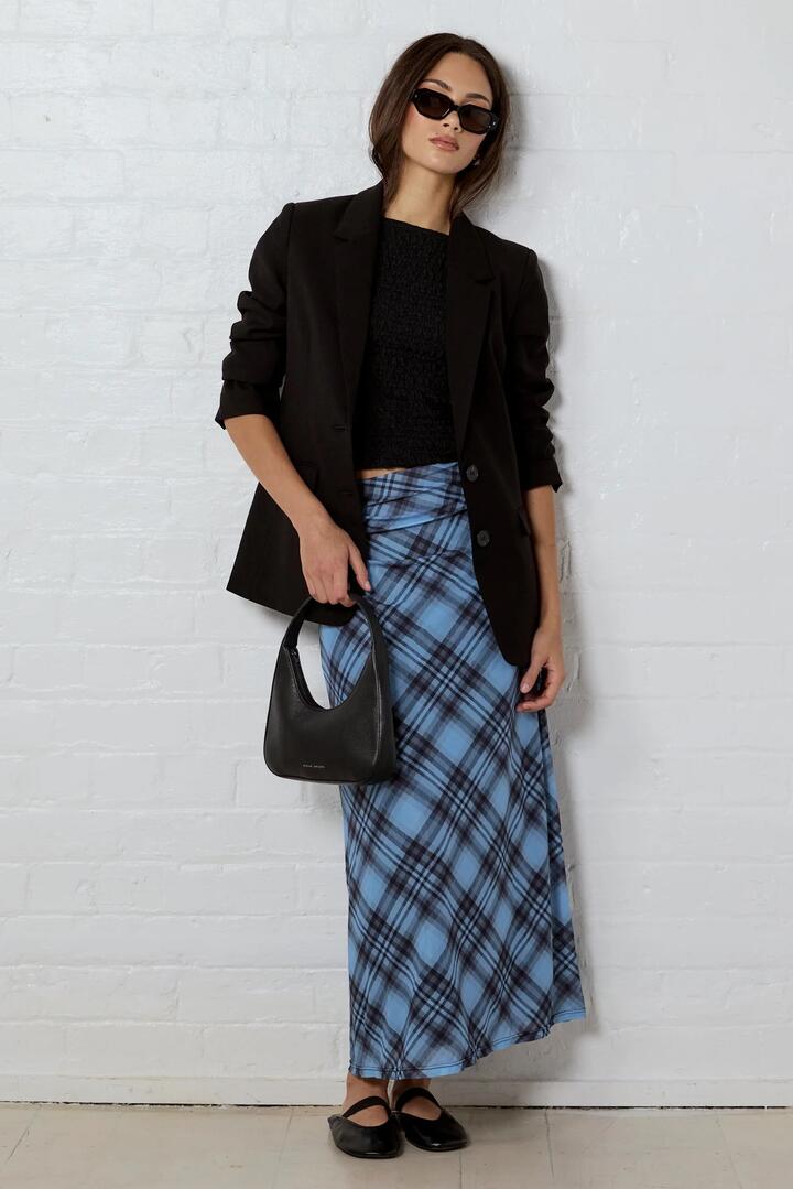 Image of a model wearing Skirts. Product name - Enlighten Blue Check Mesh Maxi Skirt in Blue Check colour by brand - Among the Brave