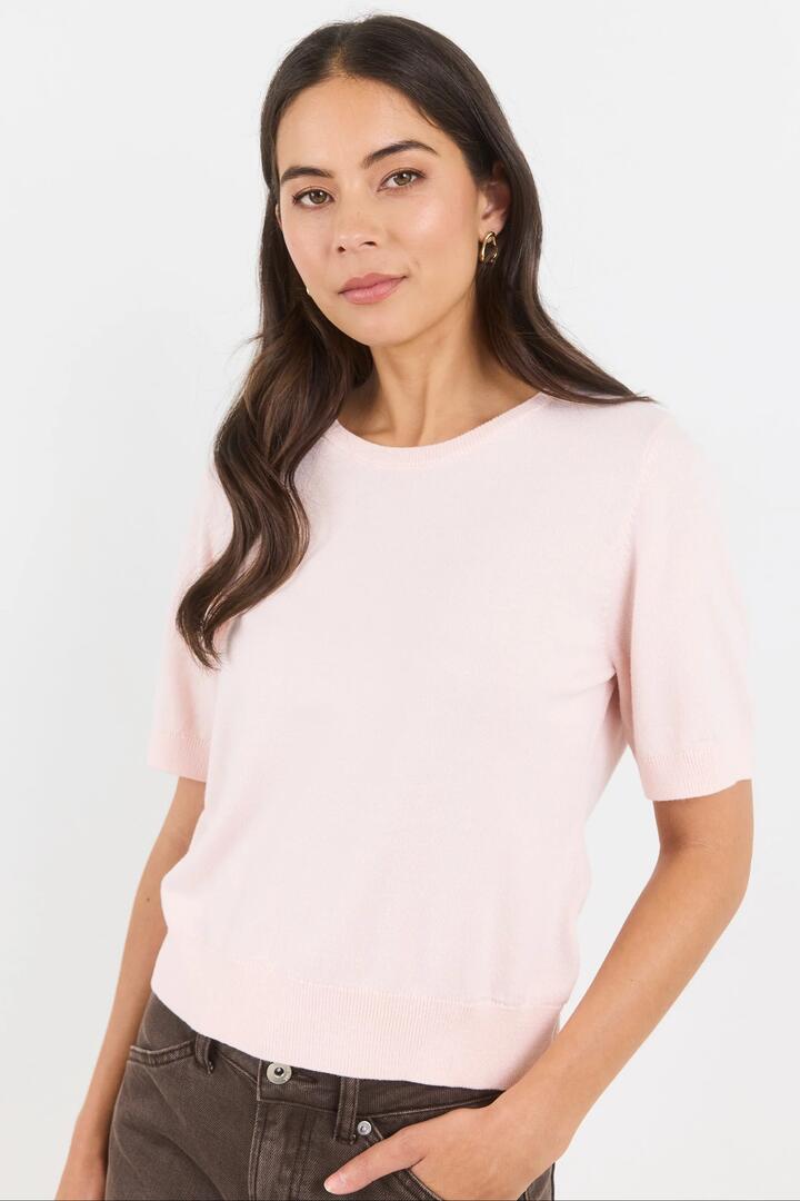 Image of a model wearing Outerwear. Product name - Edition Blush Crewneck Cashmere Blend Knit Tee in Blush colour by brand - Stories be Told