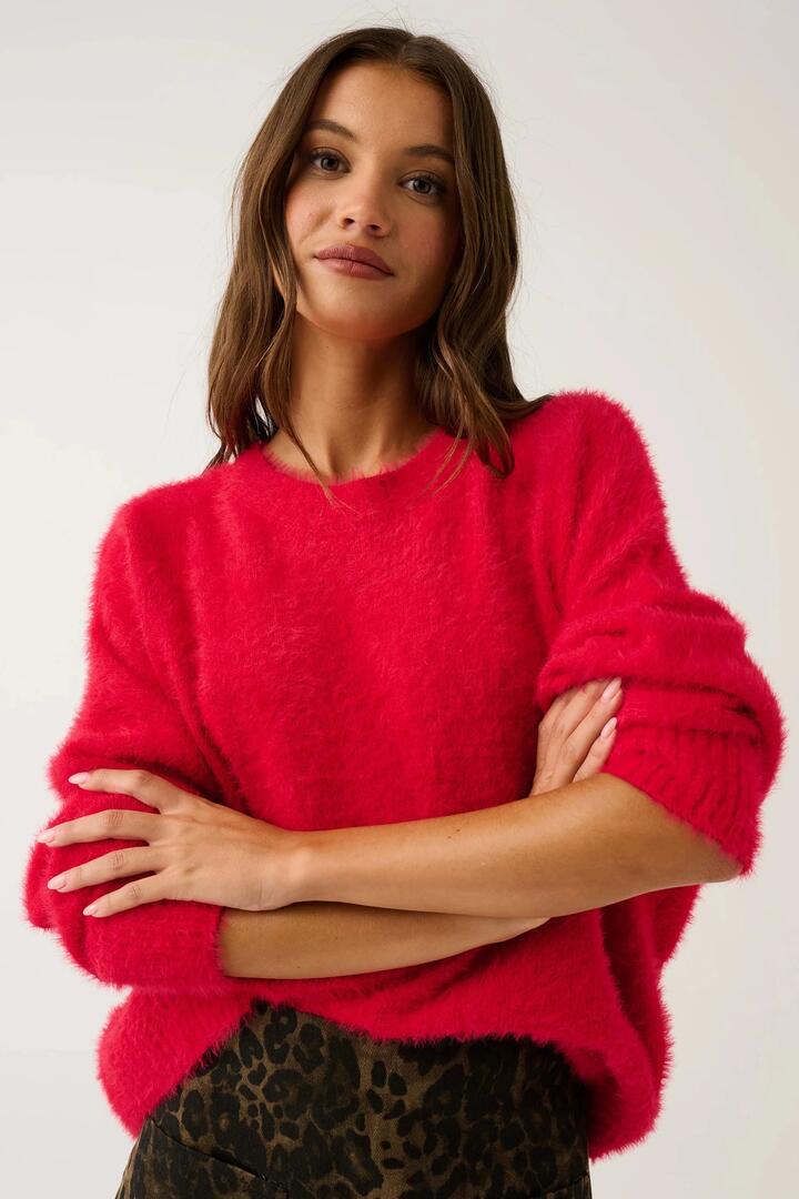 Image of a model wearing Outerwear. Product name - Ayla Scarlet Red Crew Knit Sweater in Red colour by brand - Cartel & Willow