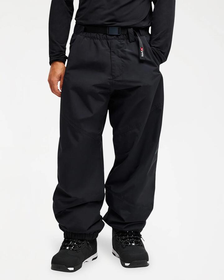 Image of a model wearing Pants. Product name - Quiksilver Mens Snow Down 10K Snow Pants Black in Black colour by brand - Quiksilver