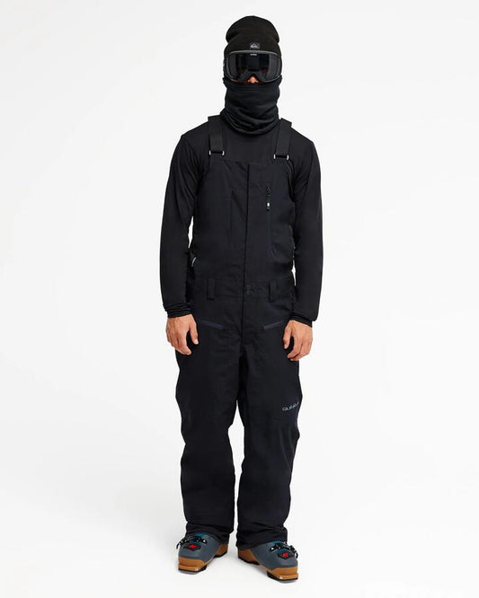 Image of a model wearing Pants. Product name - Quiksilver Mens Paramo Stretch 20K Bib Snow Pants Black in Black colour by brand - Quiksilver