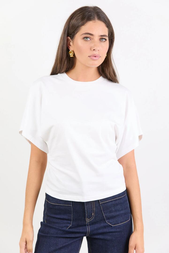 Image of a model wearing Tops. Product name - Cadence White Cotton Gathered Waist Detail Short Sleeve Tee in White colour by brand - RE:UNION Label