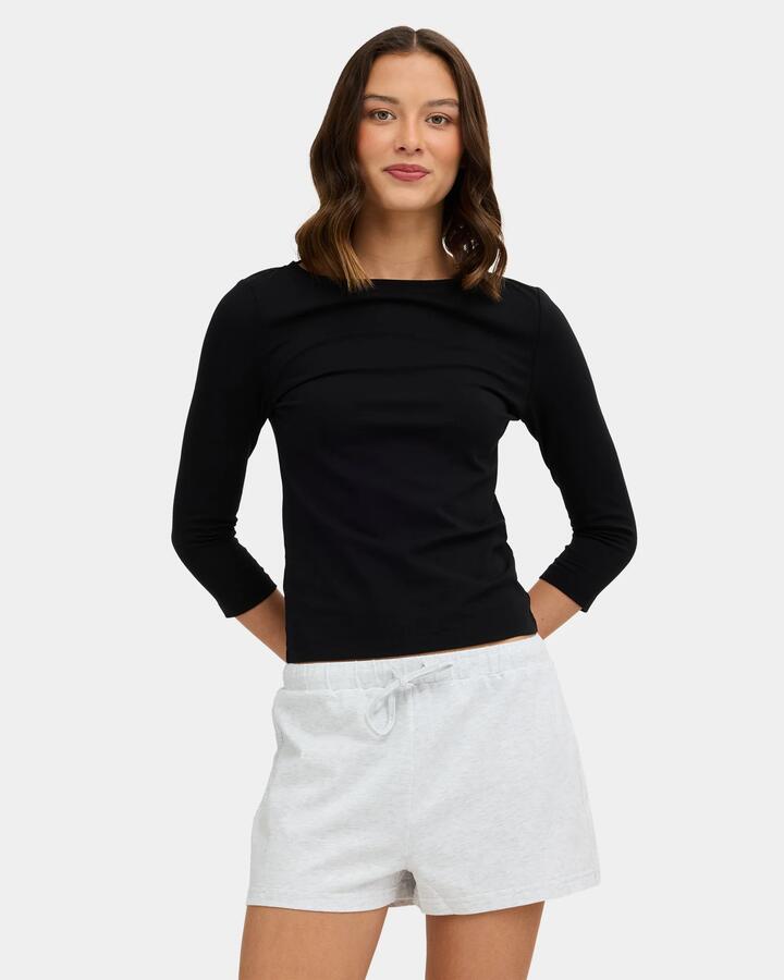 Image of a model wearing Tops. Product name - Nunui Womens Sabrina 3/4 Long Sleeve T-Shirt Black in Black colour by brand - Nunui