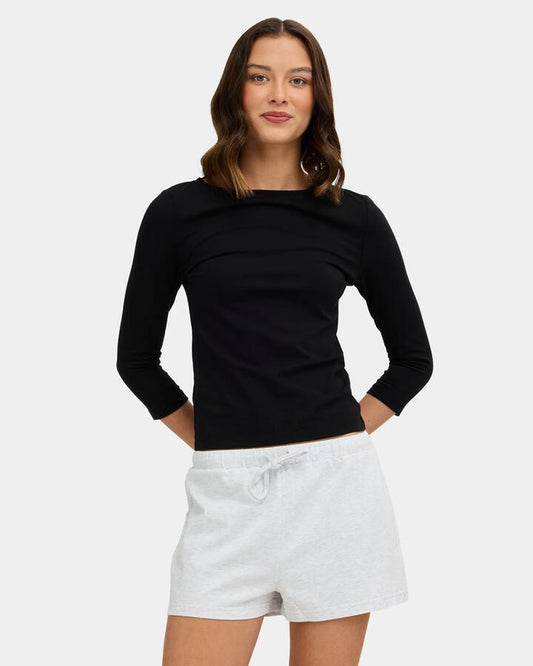 Image of a model wearing Tops. Product name - Nunui Womens Sabrina 3/4 Long Sleeve T-Shirt Black in Black colour by brand - Nunui