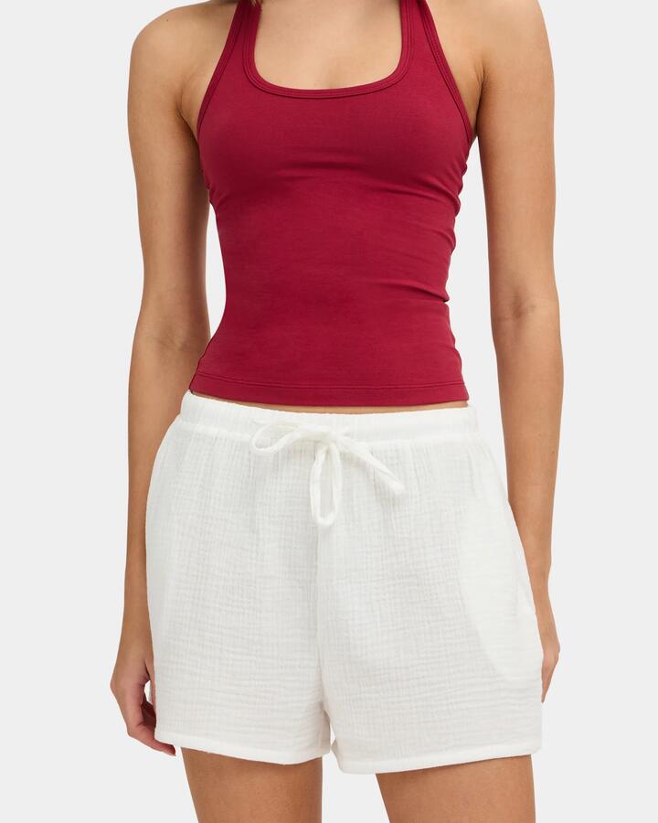 Image of a model wearing Shorts. Product name - Nunui Womens Paloma Elastic Waist Shorts Summer White in Summer White colour by brand - Nunui