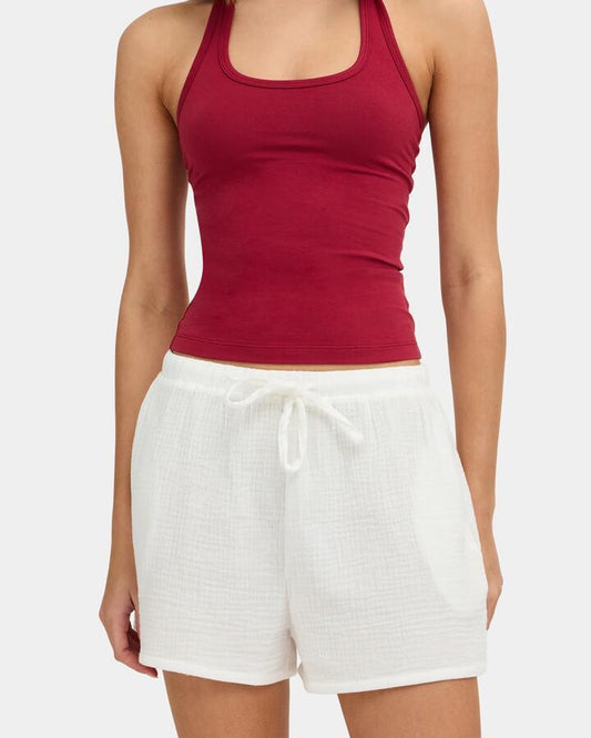 Image of a model wearing Shorts. Product name - Nunui Womens Paloma Elastic Waist Shorts Summer White in Summer White colour by brand - Nunui