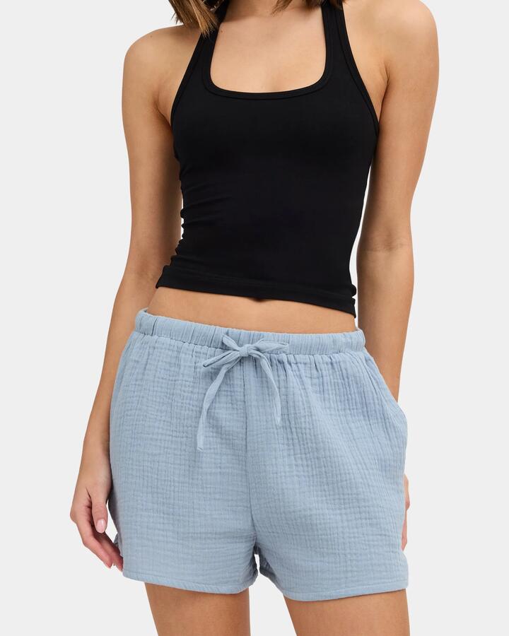 Image of a model wearing Shorts. Product name - Nunui Womens Paloma Elastic Waist Shorts Steel Blue in Steel Blue colour by brand - Nunui