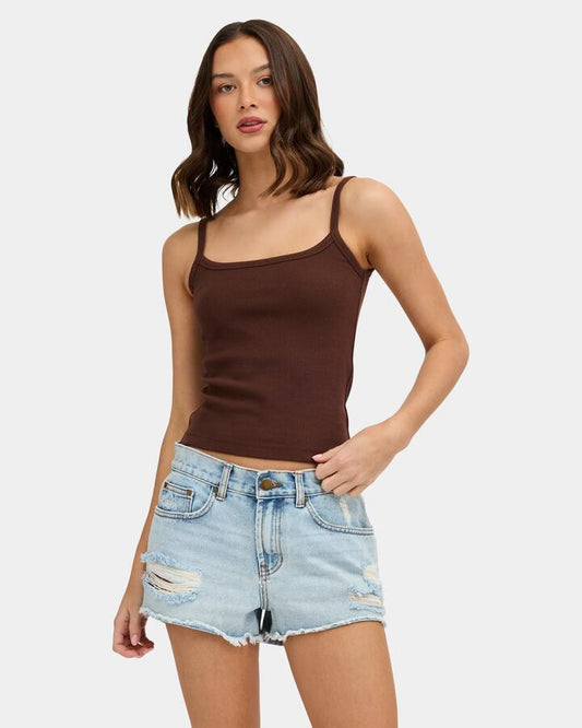 Image of a model wearing Tops. Product name - Nunui Womens The Ease Tank Top Chocolate in Chocolate colour by brand - Nunui