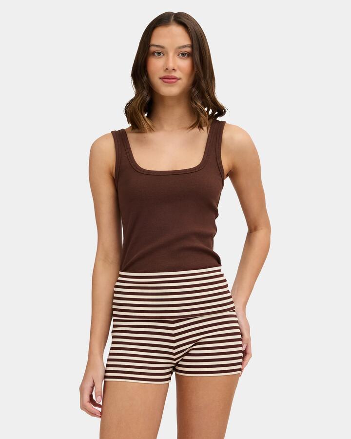 Image of a model wearing Tops. Product name - Nunui Womens Refine Me Tank Top Chocolate in Chocolate colour by brand - Nunui