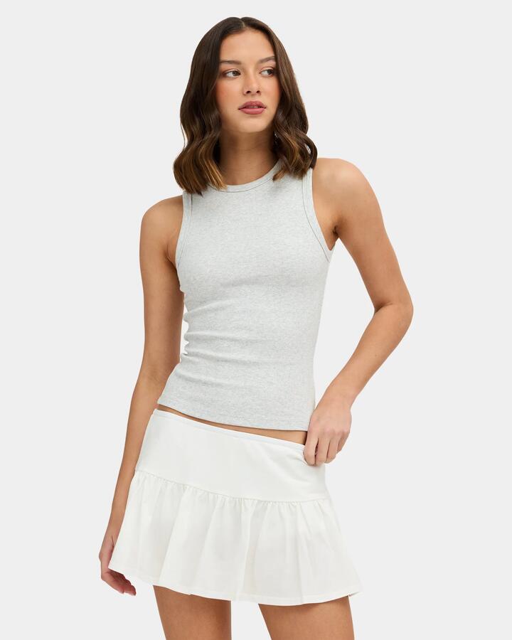 Image of a model wearing Tops. Product name - Nunui Womens Zander Tank Top Grey Marle in Grey Marle colour by brand - Nunui