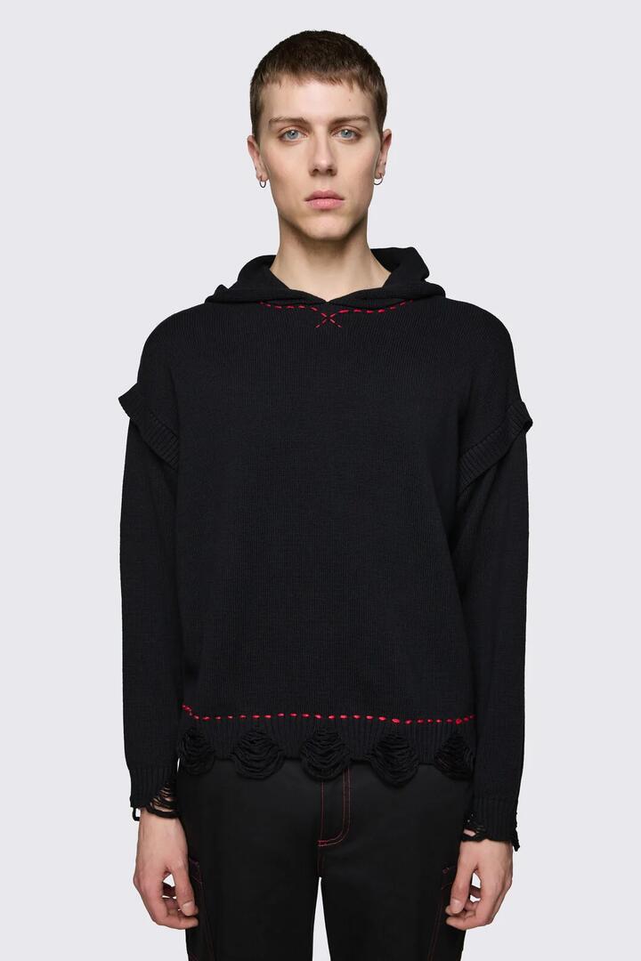 Image of a model wearing Outerwear. Product name - Trad Emo Distressed Knit Hoodie in Black colour by brand - Black Friday