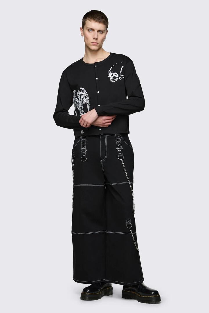 Image of a model wearing Tops. Product name - Archangel Print Jersey Cardi in Black colour by brand - Dangerfield