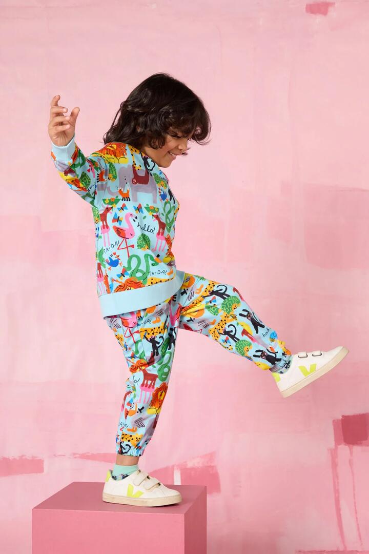 Image of a model wearing Pants. Product name - Ta-DA Kids Track Pant in Blue colour by brand - Gorman