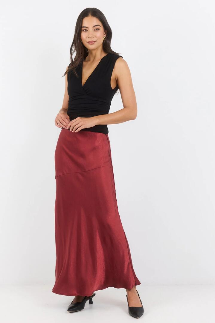 Image of a model wearing Skirts. Product name - Liberal Red Paprika Satin Bias Maxi Skirt in Red Paprika Satin colour by brand - Georgia Zoe