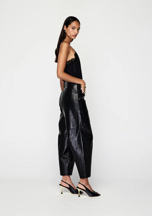Image of a model wearing Pants. Productname: Anika Leather Pants | MOS The Label in Black colour by brand - MOS The Label