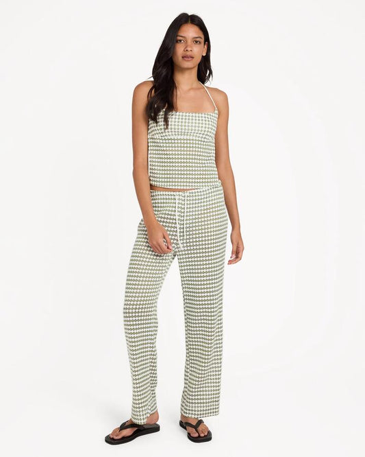 Image of a model wearing Pants. Product name - Rvca Womens Diamond Crochet Holiday Knit Pants Elm Green in Elm Green colour by brand - Rvca