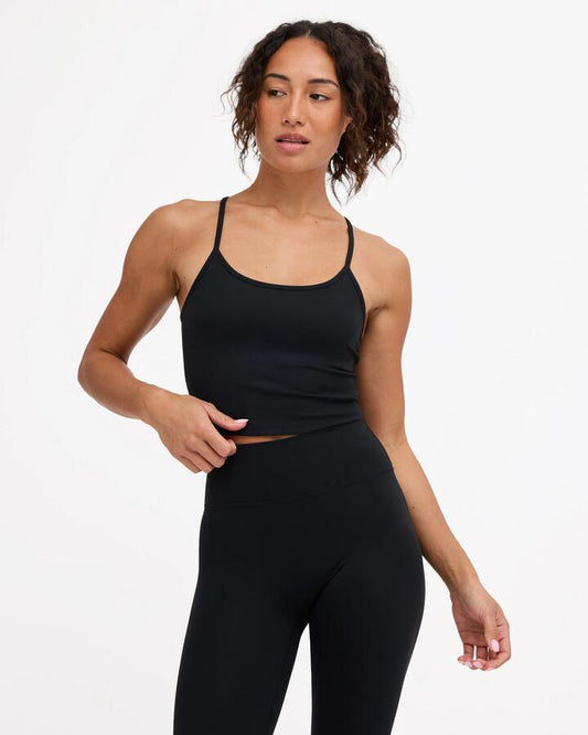 Image of a model wearing Tops. Product name - Rvca Womens Rvca Longline Tank Top Rvca Black in Rvca Black colour by brand - Rvca