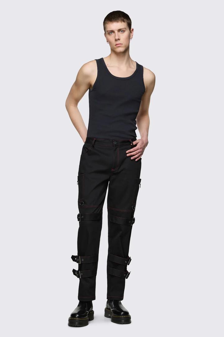 Image of a model wearing Pants. Product name - Trad Emo Belt Pants in Black colour by brand - Black Friday