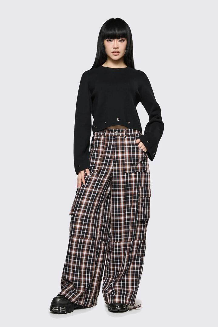 Image of a model wearing Pants. Product name - Archangel Tartan Cargo Pant in Brown colour by brand - Dangerfield