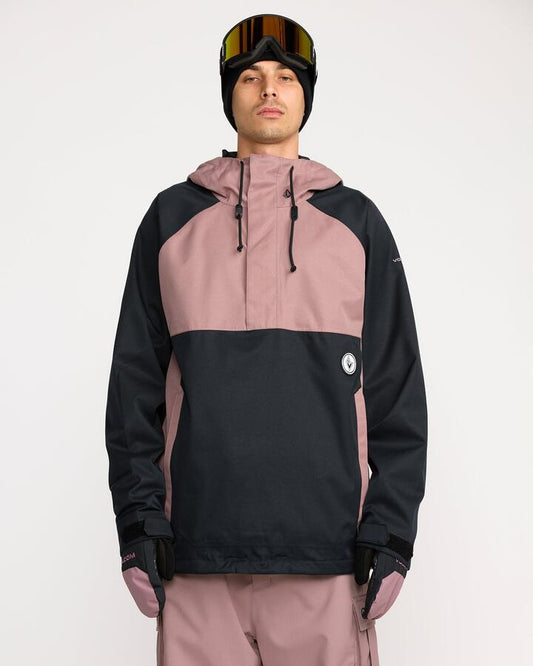 Image of a model wearing Outerwear. Product name - Volcom Hossegor 20K Pullover Military in Military colour by brand - Volcom