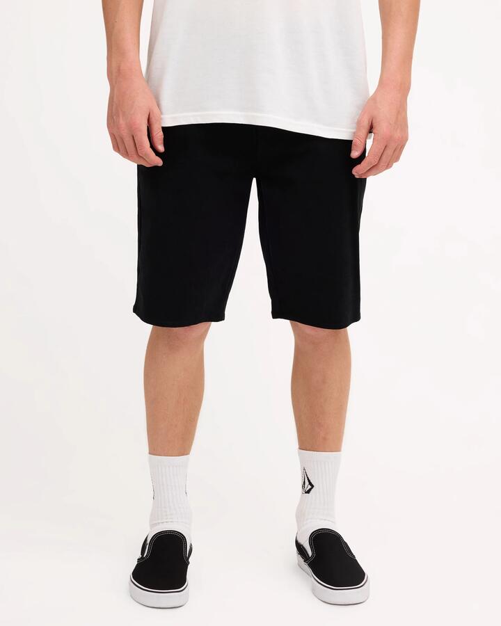 Image of a model wearing Shorts. Product name - Volcom Mens Unhinged Chino Shorts Black in Black colour by brand - Volcom