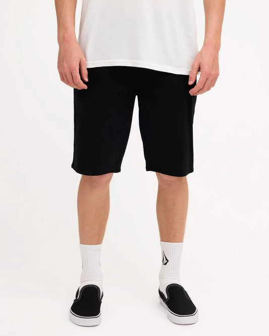 Image of a model wearing Shorts. Product name - Volcom Mens Unhinged Chino Shorts Black in Black colour by brand - Volcom