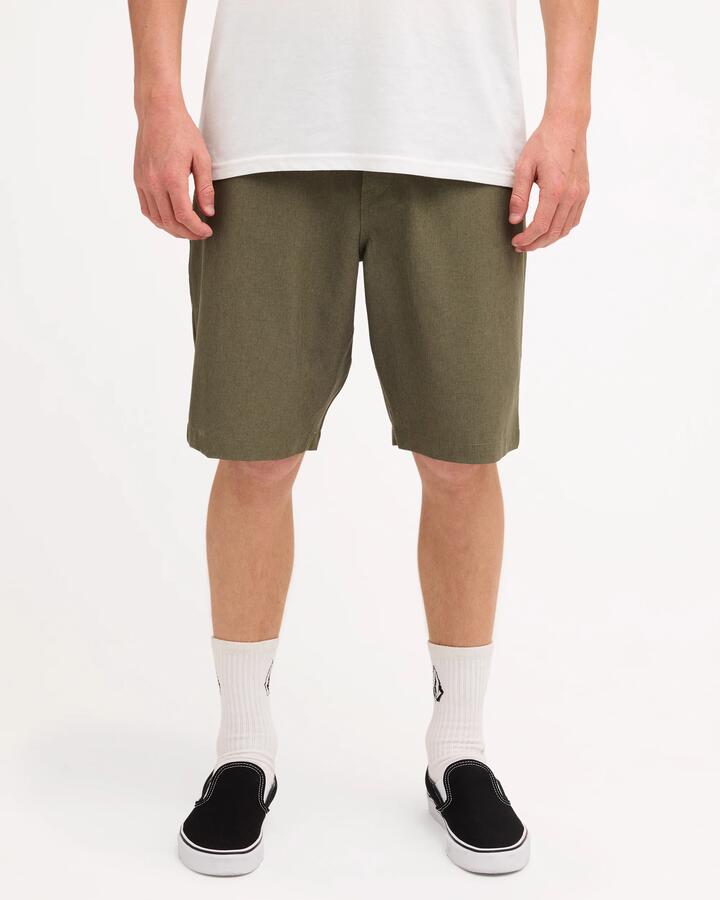 Image of a model wearing Shorts. Product name - Volcom Mens Kerosene Chino Shorts Wintermoss in Wintermoss colour by brand - Volcom