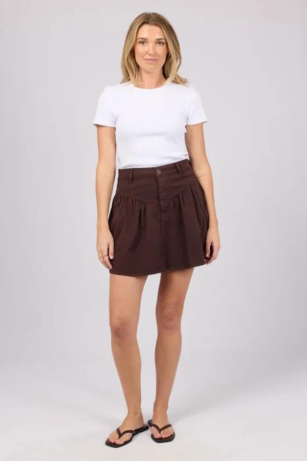 Image of a model wearing Skirts. Product name - Arlo Brown Denim Mini Skirt in Brown colour by brand - All About Eve