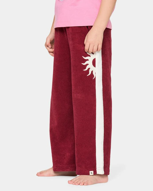 Image of a model wearing Pants. Product name - Rip Curl Girls 2-7 Road Trip Terry Pants Plum in Plum colour by brand - Rip Curl