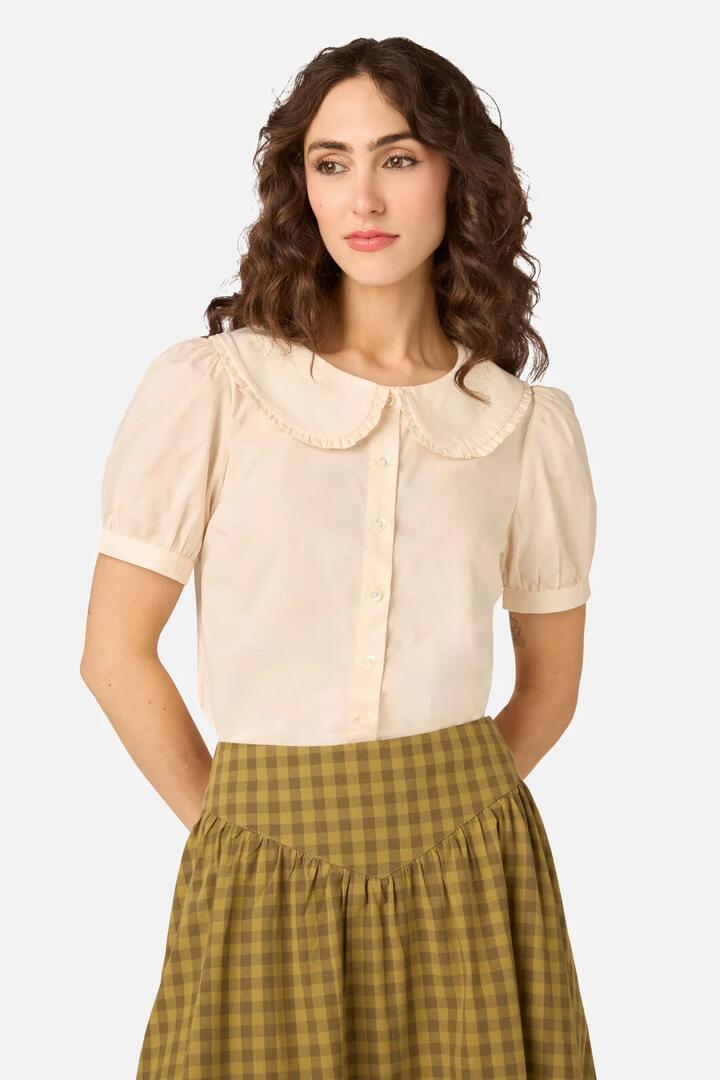 Image of a model wearing Tops. Product name - Lydia Short Sleeve Blouse in Green colour by brand - Princess Highway