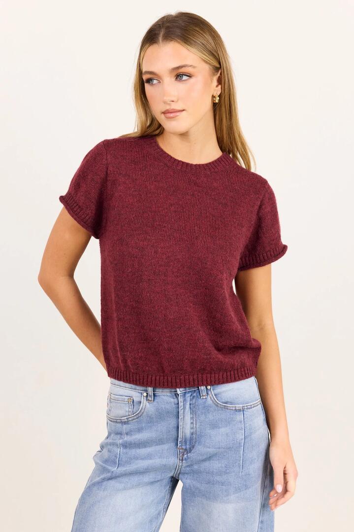 Image of a model wearing Outerwear. Product name - Lunar Burgundy Plum Crewneck Rib Cuff Detail Tee in Burgundy Plum colour by brand - Stories be Told