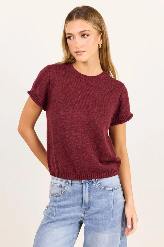 Image of a model wearing Outerwear. Product name - Lunar Burgundy Plum Crewneck Rib Cuff Detail Tee in Burgundy Plum colour by brand - Stories be Told