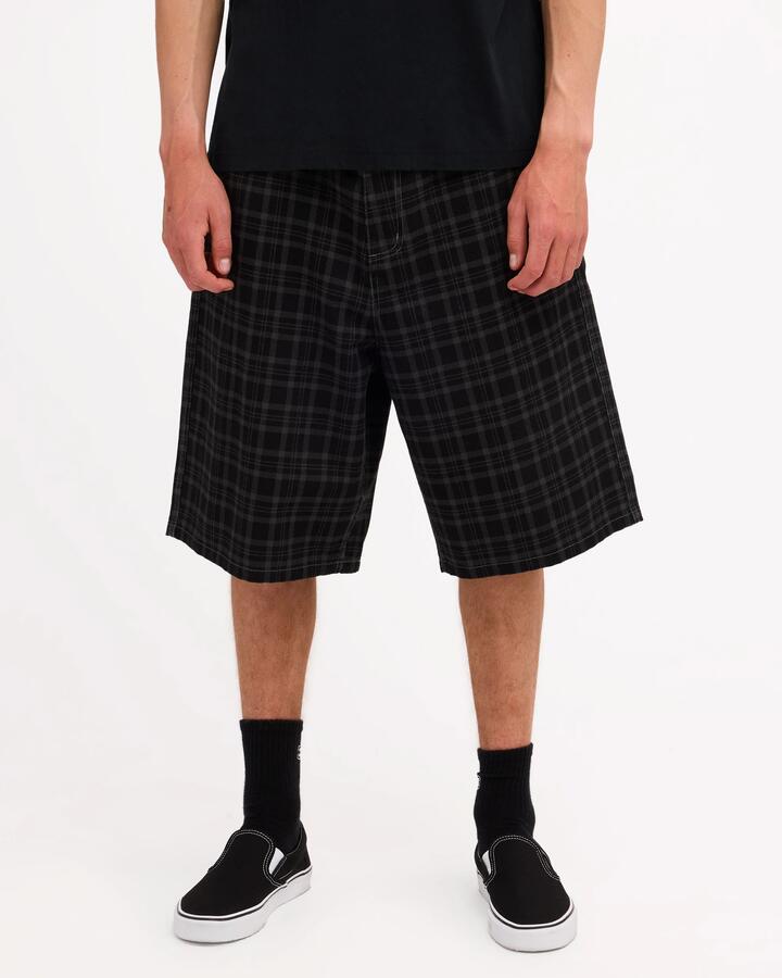 Image of a model wearing Shorts. Product name - Billabong Mens Cando Star 23" Walkshorts Black in Black colour by brand - Billabong