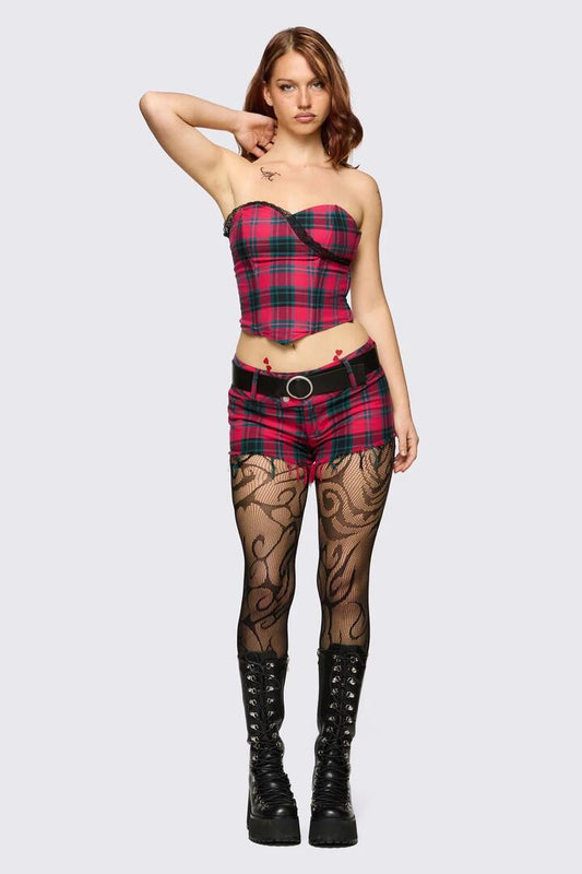 Image of a model wearing Shorts. Product name - Dizzy Tartan Micro Short in Red colour by brand - Dangerfield