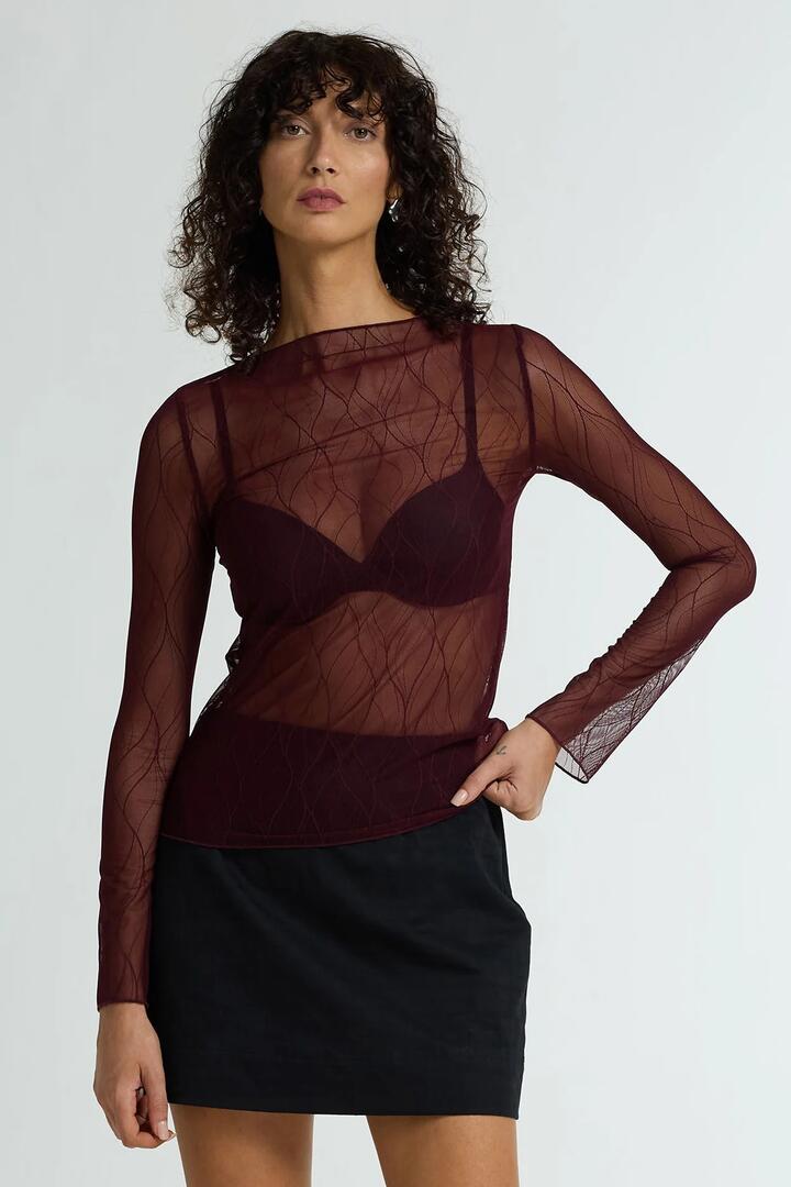 Image of a model wearing Tops. Product name - Gigi Burgundy Veil Lace LS Top in Red colour by brand - Blak
