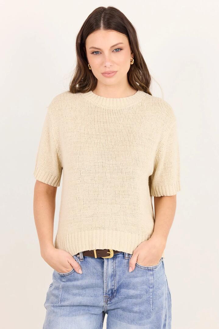 Image of a model wearing Outerwear. Product name - Loveable Oat Tape Yarn Knit Tee in Oat colour by brand - By Rosa.