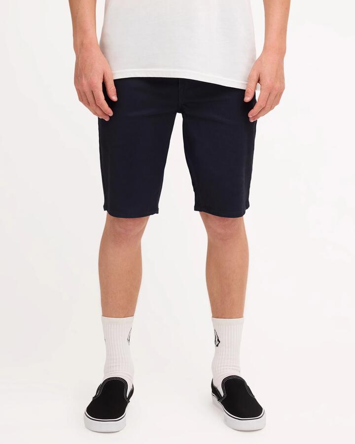 Image of a model wearing Shorts. Product name - Volcom Mens Solver Twill Shorts Navy in Navy colour by brand - Volcom