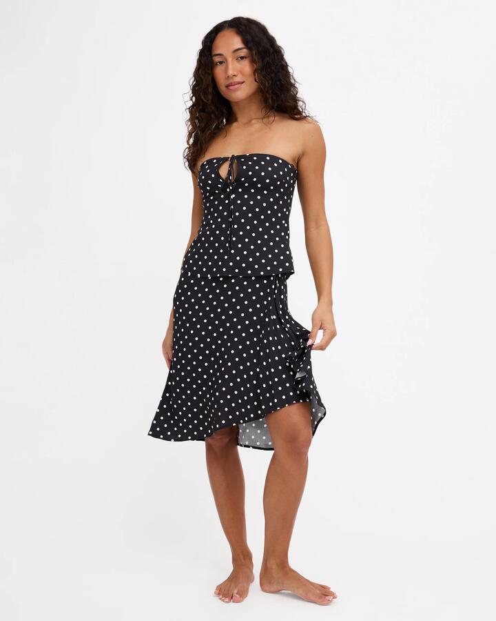 Image of a model wearing Skirts. Product name - Rvca Womens Landon Polka Dot Midi Skirt Multi in Multi colour by brand - Rvca