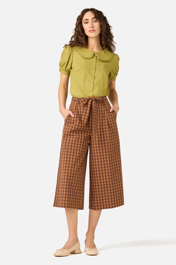 Image of a model wearing Pants. Product name - Billie Check Culotte in Chocolate colour by brand - Princess Highway