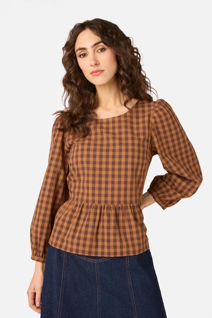 Image of a model wearing Tops. Product name - Billie Check Peplum Top in Chocolate colour by brand - Princess Highway
