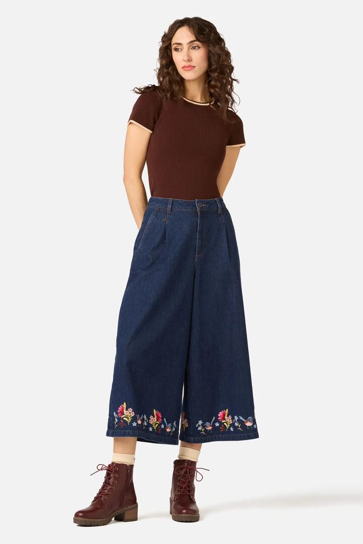 Image of a model wearing Pants. Product name - Wren Embroidered Denim Culotte in Dark Denim colour by brand - Princess Highway