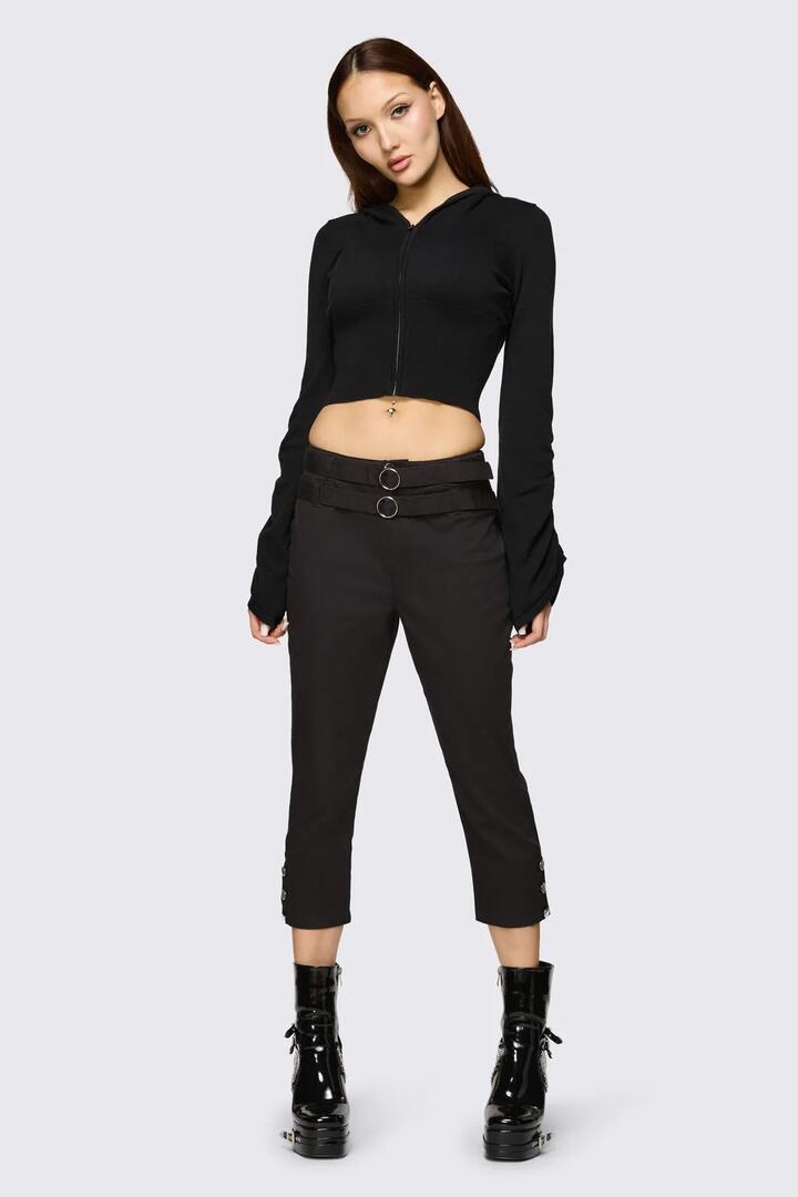 Image of a model wearing Pants. Product name - Underdog Punk Capri Pant in Black colour by brand - Dangerfield